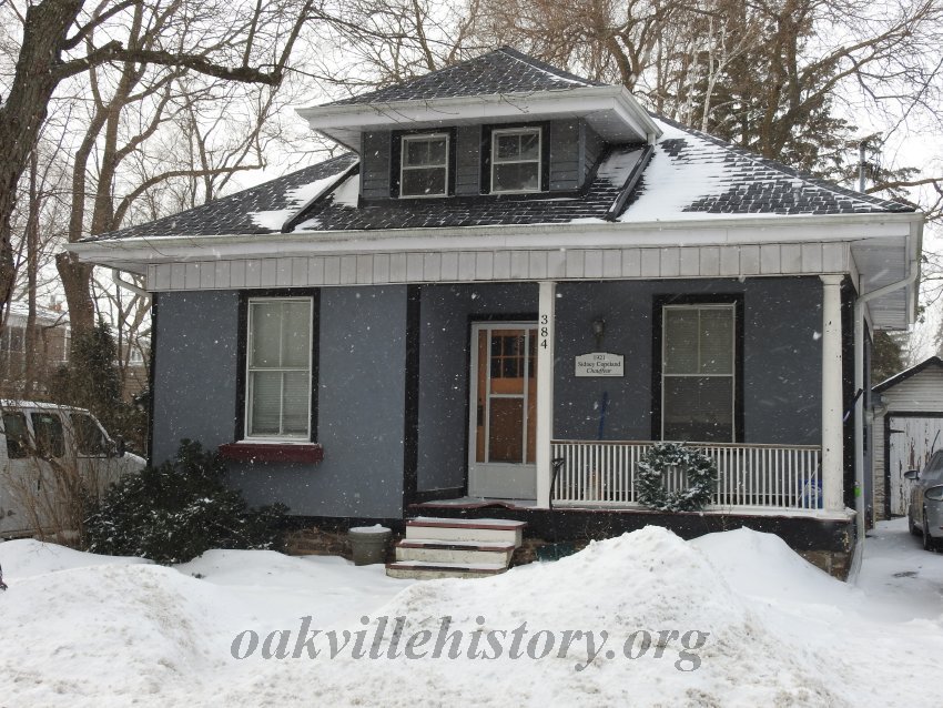 Small grey house winter time