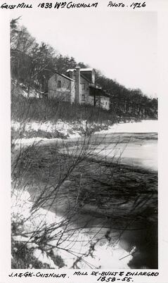 Old black and white photo of a mill on Sixteen Mile Creek