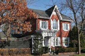 Color photo of red brick house