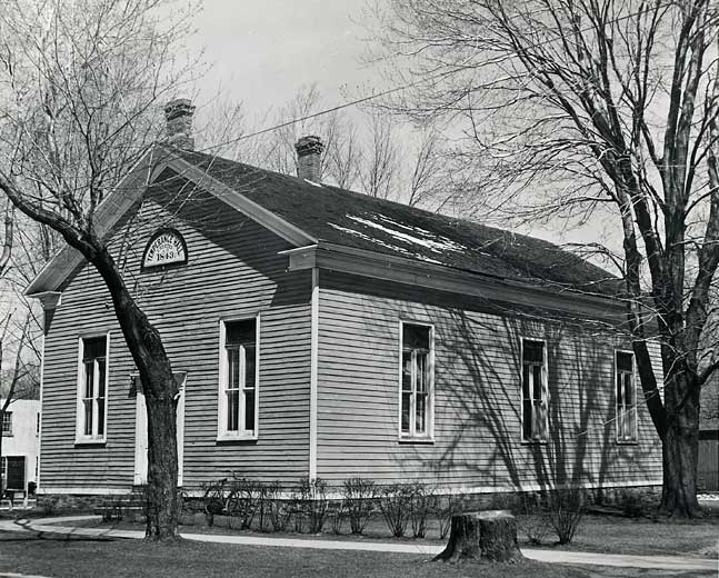 Black and white photo of one story building 1843