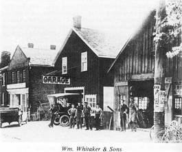 Black and white photo of old shops circa 1850 with horse and buggy