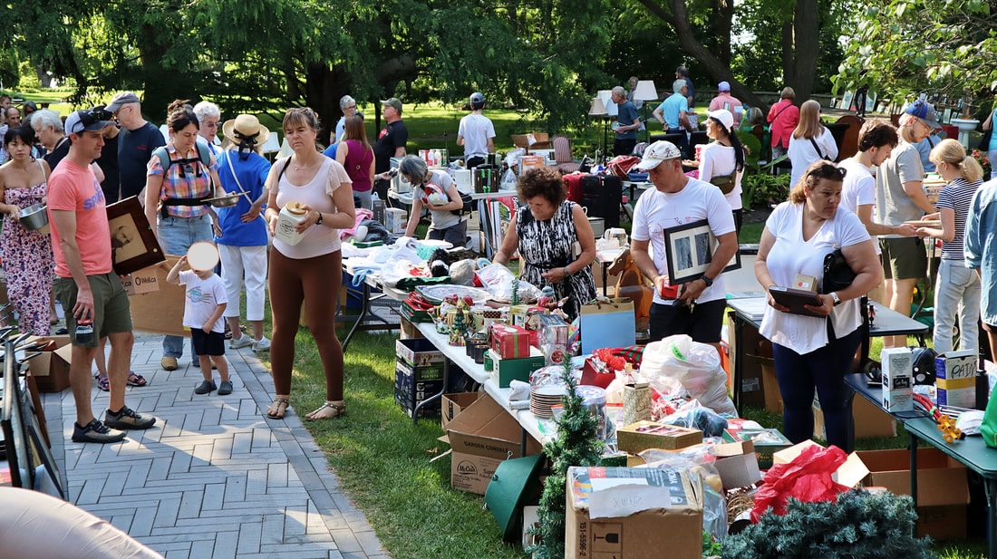 Photo of people browsing at yard sale