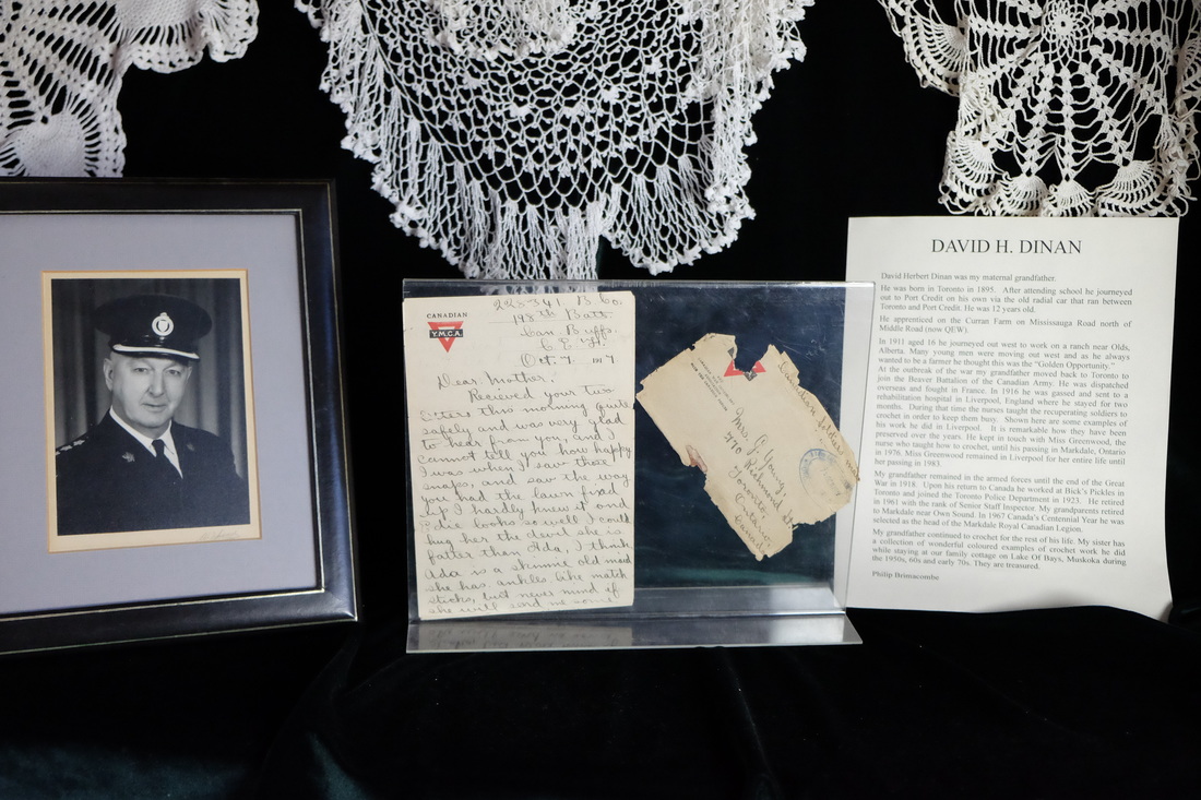 Photo of exhibit with old letters under antique lace