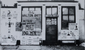 vintage photo of store front 164 halton battalian action district must supply 100 men