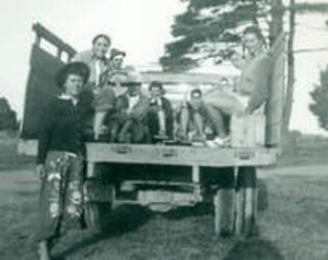 Photo of Farmerettes sitting on a wagon